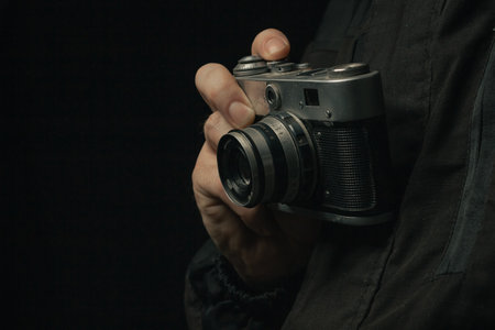 Retro film photo camera isolated on white backgroundの写真素材