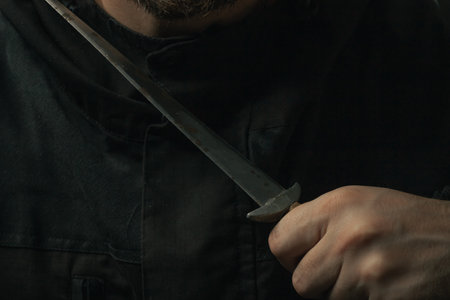 hand holding medieval antique dagger knife