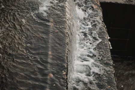 A waterfall flowing at park Wall of water A beautiful view of the falling water cascade city...