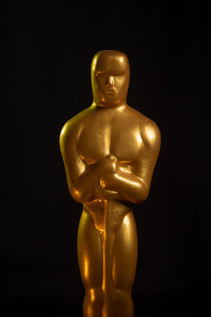 Hollywood Golden Oscar Academy award statue on black background Success and victory conceptの写真素材