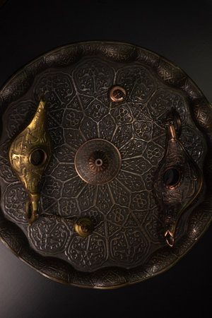 Aladdin's magic lamp isolated on black background