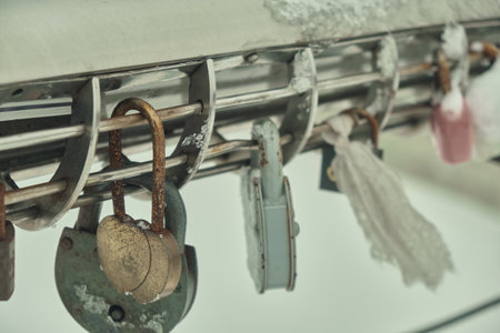 Frozen padlocks are installed along the bridge path and the love locks are thrown into the river with the hope of loving bonds continue to be non-releasable Natural light selective focusの写真素材