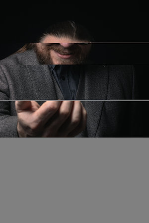 charismatic man in a classic suit and steampunk goggles on a black background stylish Portrait