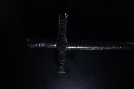 christian crucifix and rosary beads on abstract grey background. spiritual symbol of Lent. Orthodox, Catholic, Protestant religion, faith in God, Church holiday concept. flat layの写真素材