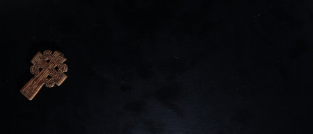 christian crucifix and rosary beads on abstract grey background. spiritual symbol of Lent. Orthodox, Catholic, Protestant religion, faith in God, Church holiday concept. flat layの写真素材