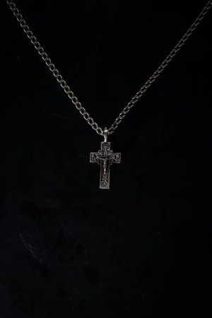 christian crucifix and rosary beads on abstract grey background. spiritual symbol of Lent. Orthodox, Catholic, Protestant religion, faith in God, Church holiday concept. flat layの写真素材