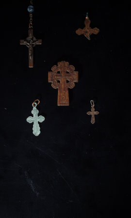 christian crucifix and rosary beads on abstract grey background. spiritual symbol of Lent. Orthodox, Catholic, Protestant religion, faith in God, Church holiday concept. flat layの写真素材