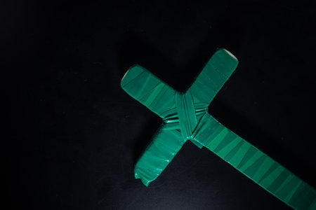 christian crucifix and rosary beads on abstract grey background. spiritual symbol of Lent. Orthodox, Catholic, Protestant religion, faith in God, Church holiday concept. flat layの写真素材