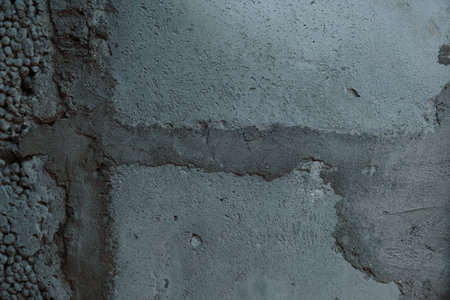 Old concrete wall with water drips and traces with moss texture Perfect for backgroundの写真素材