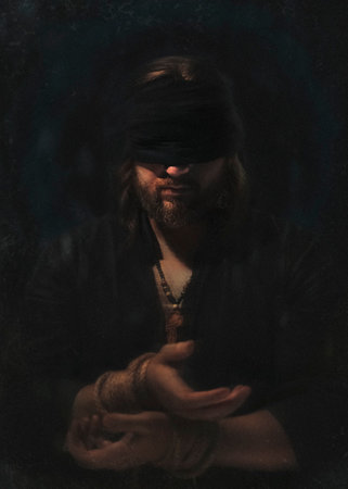 Artistic photo of a Prisoner blindfolded and hands tied with black background homage to Dostoevsky's novel The Idiotの写真素材