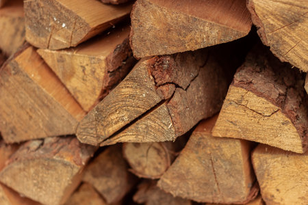 Split birch logs for the fireplace are stacked on top of each other. Wood for a picnic. Betulaceae. Firewoodの写真素材