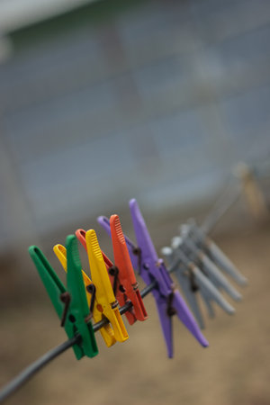 multi-colored plastic clothespin on rope