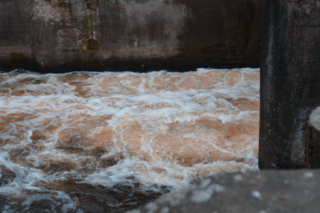 Dam of small hydroelectric power station, water discharge through locksの写真素材