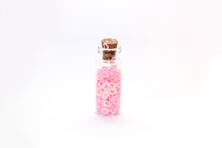 Glitter (small figurines) in small glass bottles with corksの写真素材