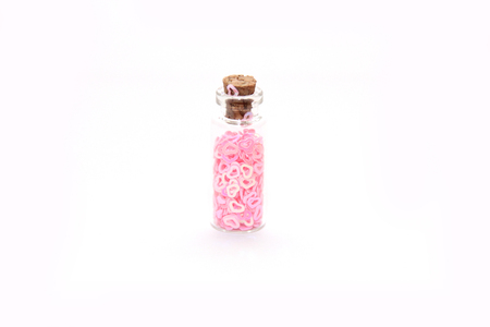 Glitter (small figurines) in small glass bottles with corksの写真素材