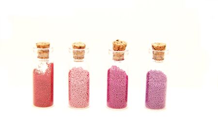 Glitter (little balls) in small glass bottlesの写真素材