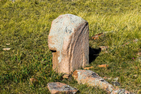 Ancient megalithic tombstones in a meadow in the Khakassia, Siberia, Russiaの写真素材