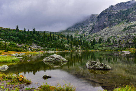 Lake in the mountains. The concept of active, ecological and photo tourism. Ergaki Nature Park, Russia, Krasnoyarsk Territory, Siberiaの写真素材