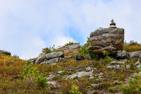 Stone cairn on the top of a mountain in Ergaki Nature Park, Russia, Krasnoyarsk Territory, Siberia.の写真素材