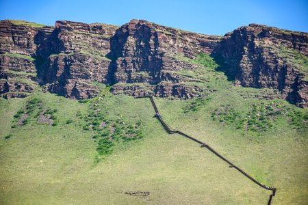 Mountain landscape with a hiking trail in the foreground, Khakassia, Siberia, Russiaの写真素材