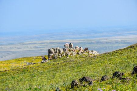 Mountain landscape with stones and grass on a background of blue sky. Khakassia, Siberia, Russia, Sahsyrの写真素材