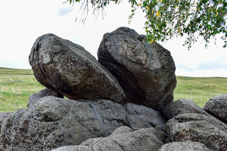 Large granite boulders in a meadow on a sunny summer day. Khakassia, Siberia, Russia, Sahsyrの写真素材