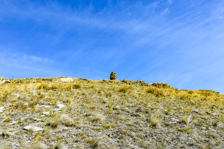 Stone pyramid in the steppe on the background of the blue sky. Khakassia, Siberia, Russia, Sahsyrの写真素材