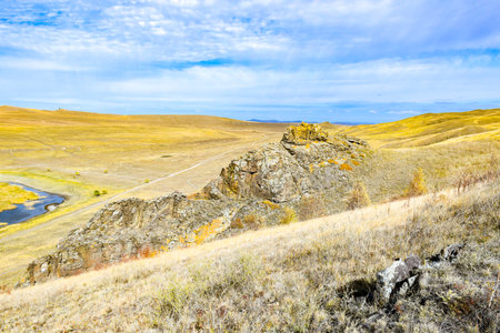 Autumn steppe on a background of blue sky with clouds. Khakassia, Siberia, Russia, Sahsyrの写真素材