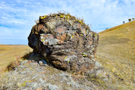 Rocky hillside on the background of the blue sky with clouds. Khakassia, Siberia, Russia, Sahsyrの写真素材