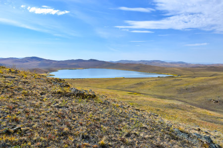 landscape with lake and mountains under the blue sky. Khakassia, Siberia, Russiaの写真素材