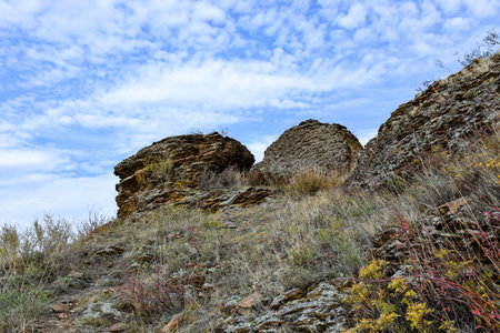 Rocks in the steppe of Khakassia, Siberia, Russia on a background of blue skyの写真素材