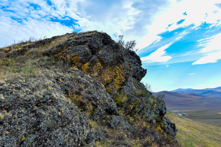 Mountain landscape in the spring on a background of blue sky with clouds. Khakassia, Siberia, Russiaの写真素材