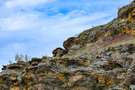 Rocky landscape in the steppe against the blue sky with clouds. Khakassia, Siberia, Russiaの写真素材