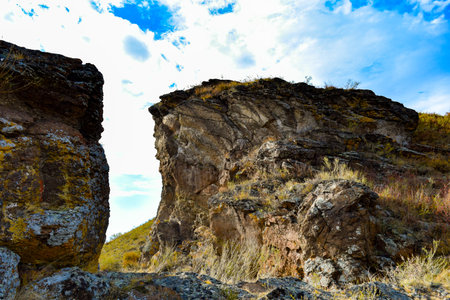 Rocky cliffs on the slope of the mountain against the blue sky. Khakassia, Siberia, Russiaの写真素材