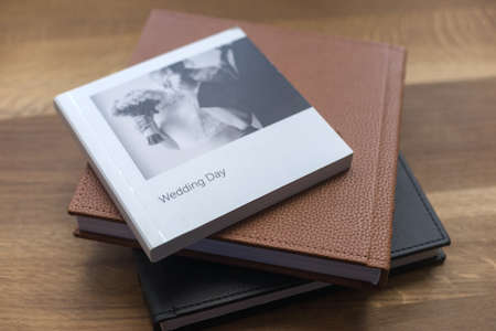 Some wedding books lying on nice wooden countertopの写真素材