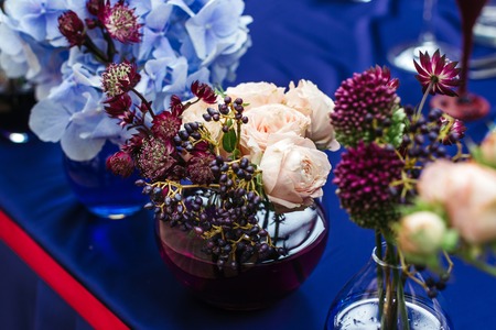 Beautiful decor at the wedding. Flowers standing on the table. Top-down planの写真素材