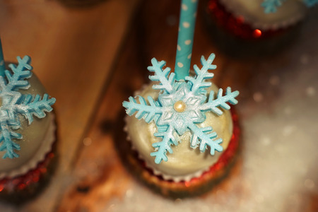 Lollypop closeup on the snow. Decorated with sugar snowflakes.の写真素材