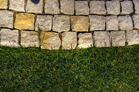 Beautiful walkway view from above, the border of a stone and a beautiful lawn.の写真素材