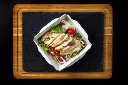 Salad with chicken on a paper box-2の写真素材