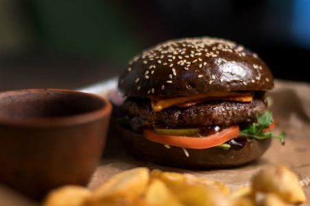 Black double hamburger made from beef, cheese and vegetables-2.の写真素材