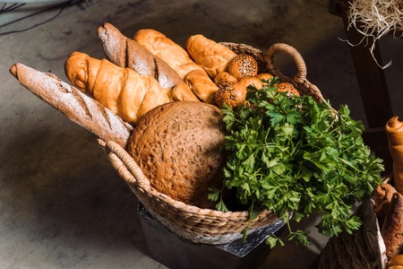 Wicker baskets with bread and greens-2の写真素材
