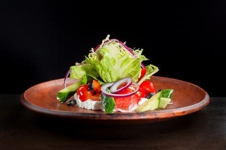 Fresh caesar salad in clay plate.の写真素材