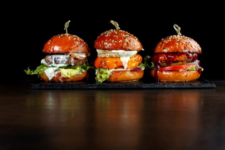 Set burgers with beef. On a black background.の写真素材