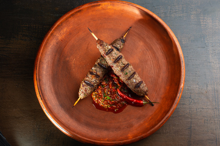 Shish kebab on a stick, minced meat. Traditional Caucasian dish.の写真素材