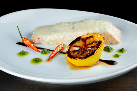 Salmon steak cream sauce, with lemon and paper-2の写真素材