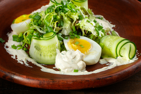 Greek salad. With egg, cucumbers and mayonnaise.の写真素材