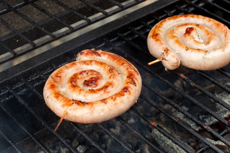 Delicious german sausages on the barbecue grill.の写真素材