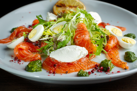 Salad from eggs, greens and trout.の写真素材
