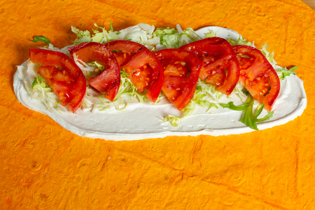 Tortilla shawarma. Tomatoes, barbecue and mayonnaise sauce.の写真素材