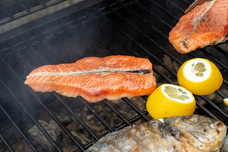Grilled salmon steak on the flaming.の写真素材
